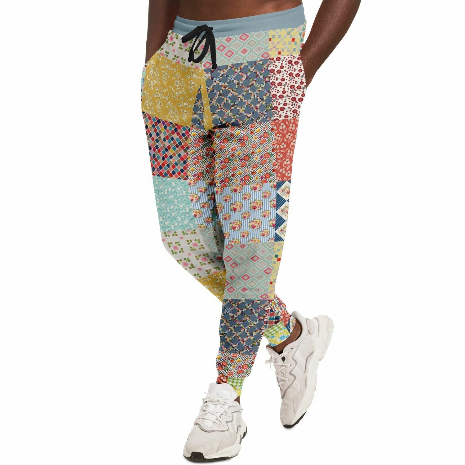 Joggers unisex de eco-poliéster con patchwork floral azul 