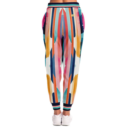 Joggers unisex de poliéster ecológico con rayas abstractas y lluvia en bloques de color rosa 