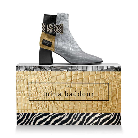 Mina Baddour Matrix con botines plateados con cinturón